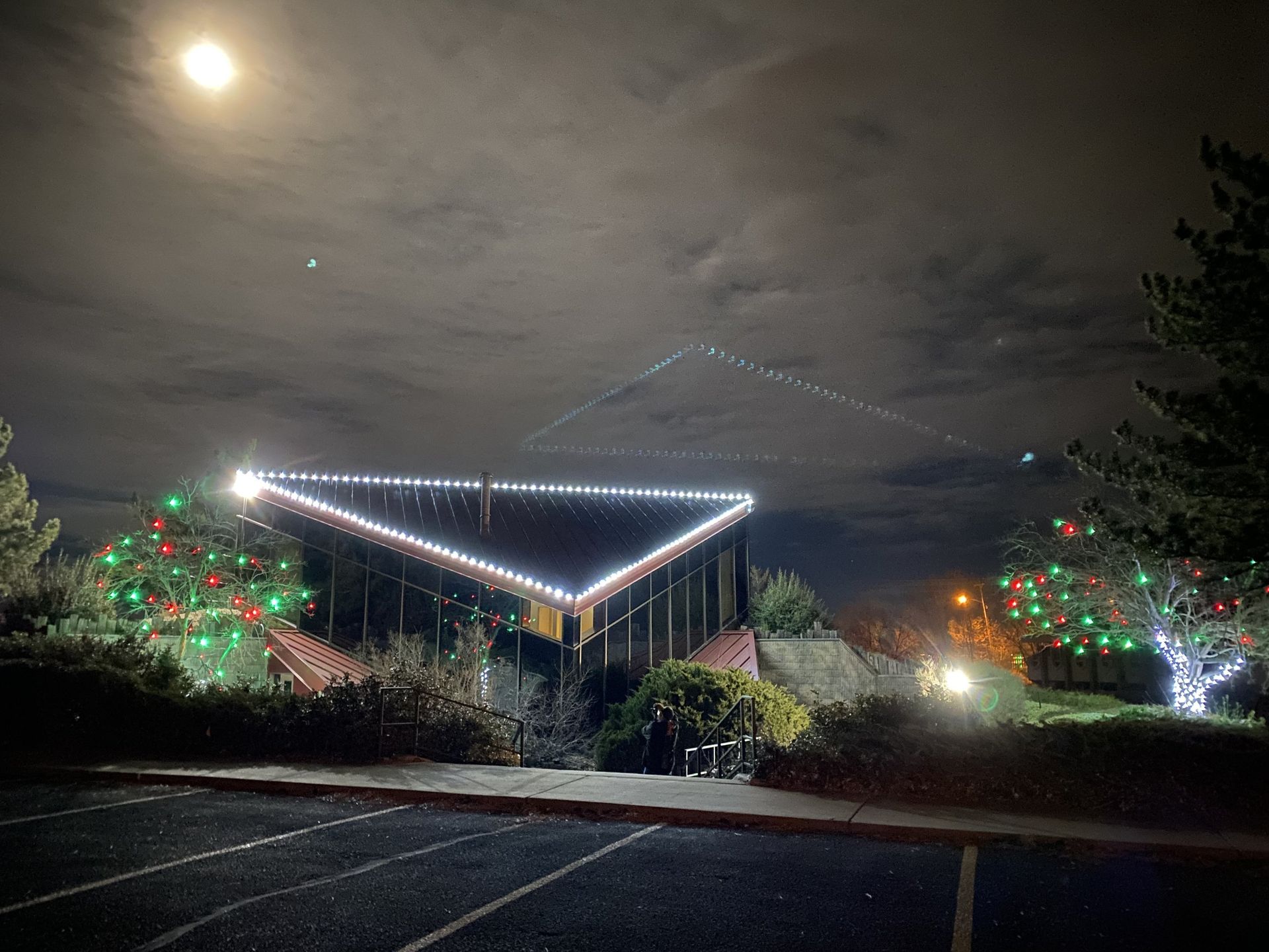 Outdoor event lit with string lights
