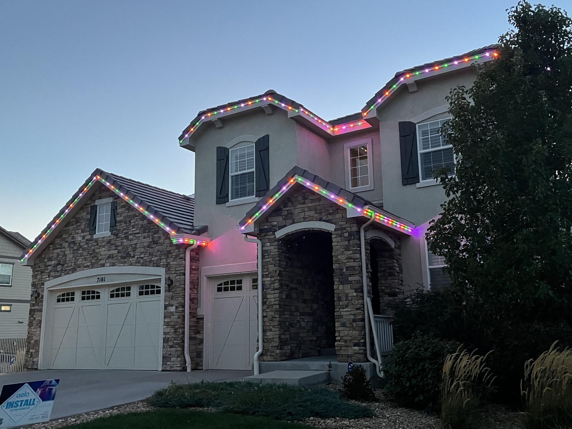 Entryway lit in holiday colors with Oelo lights
