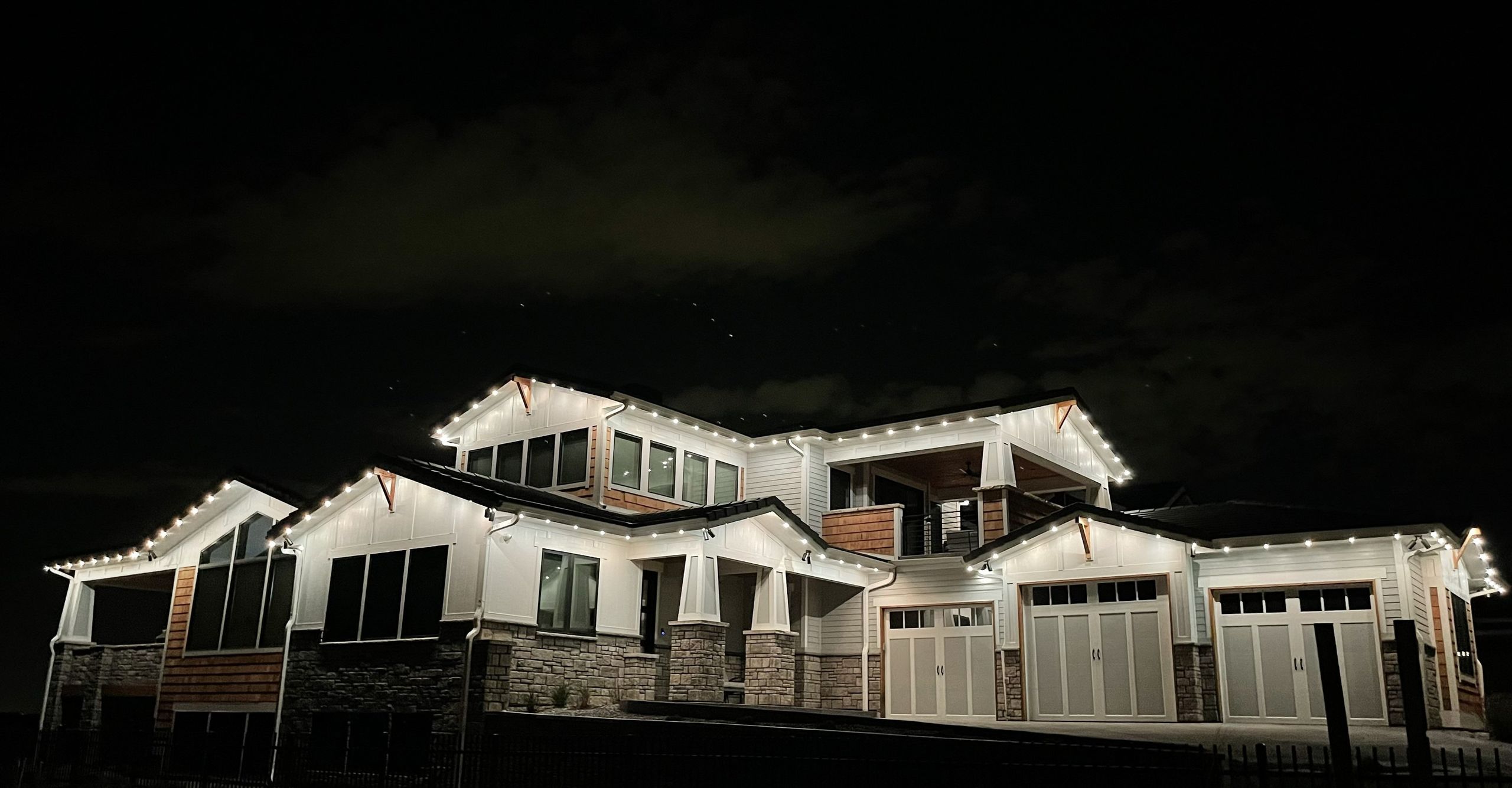 Colorado home outlined with permanent lights at night